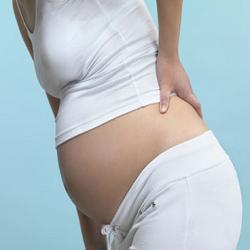 Боль в спине и пояснице во время беременности. Фото